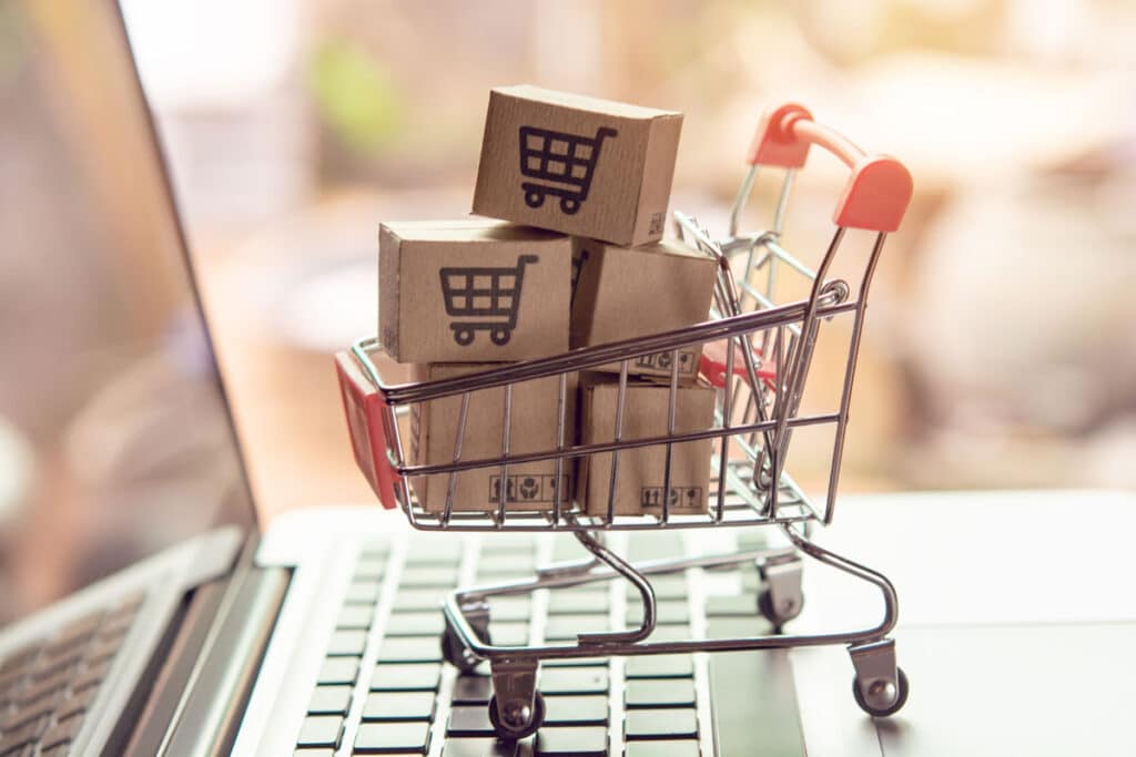 shopping-cart-on-laptop-keyboard-with-boxes-in-cart-that-have-pictures-of-shopping-carts-on-them
